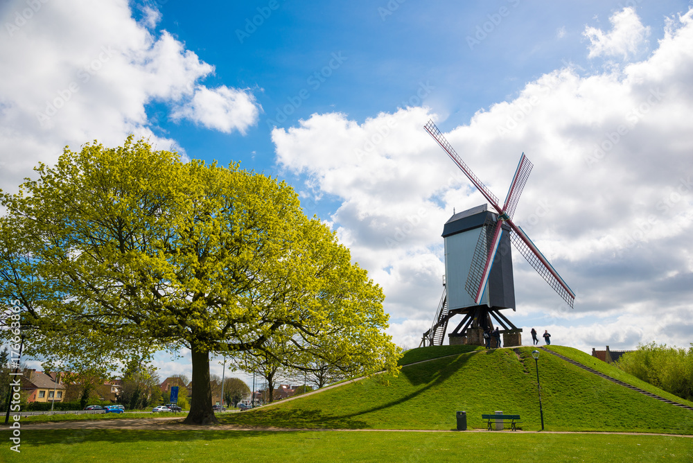Naklejka premium Wooden windmill in Bruges, Belgium