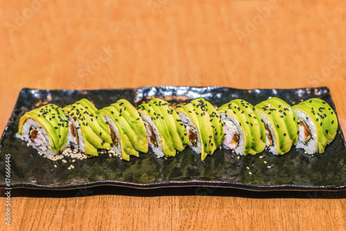The cooked sushi on a black plate © okskukuruza