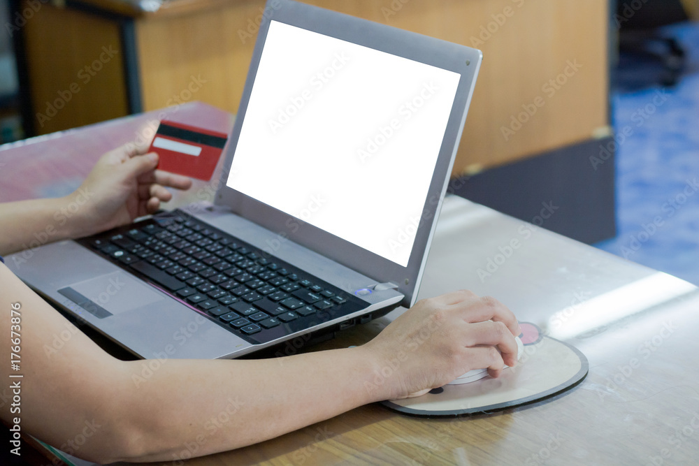woman hand holding credit card and using laptop computer. Online shopping concept woman hand holding credit card and using laptop computer. Online shopping concept