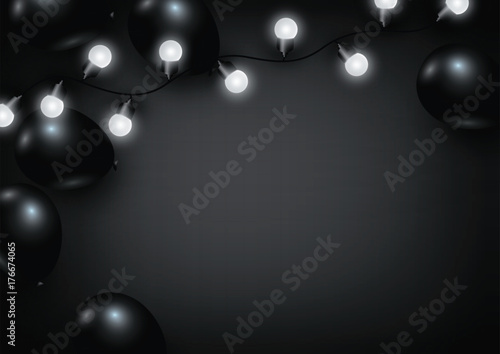 Balloon and light bulb on black background