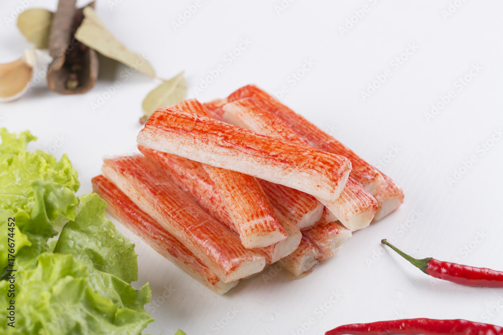 Red crab stick with green lettuce and coriander, pepper and other spices. Red crab stick with green lettuce and coriander, pepper and other spices.