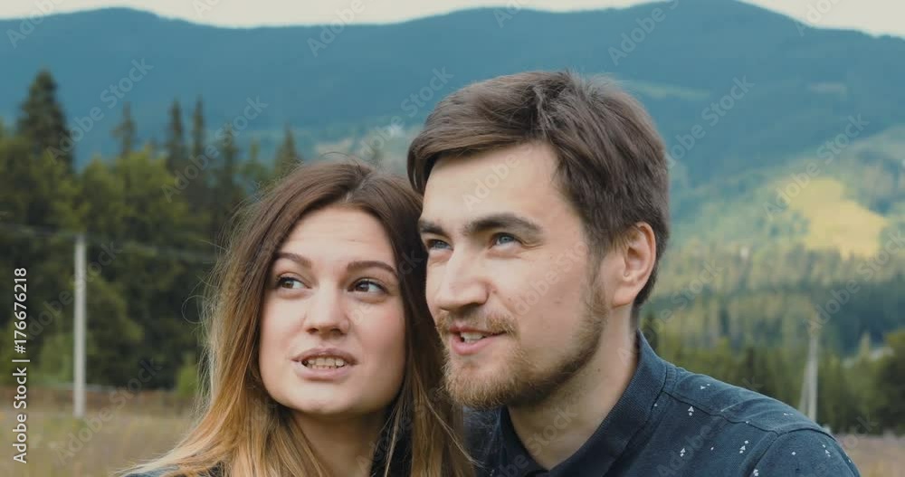 Couple hikers sightseeing standing mountain enjoying observing peaks mountains wild nature amazing landscape inspiration meditative place silence expression interest emotional face man woman happy Couple hikers sightseeing standing mountain enjoying observing peaks mountains wild nature amazing landscape inspiration meditative place silence expression interest emotional face man woman happy