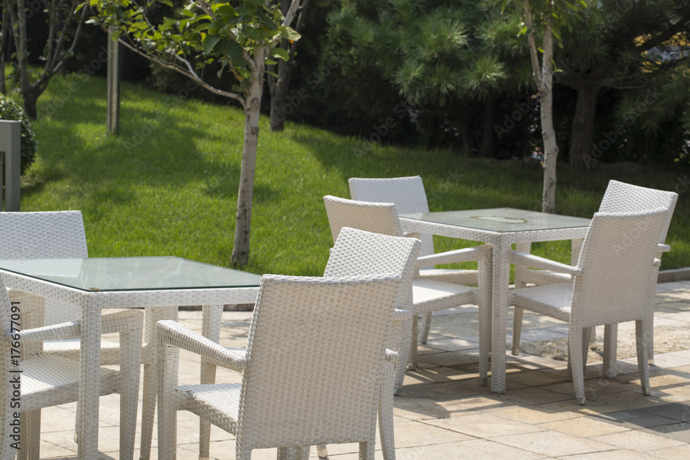 Beauty image of garden furniture outside cafe.