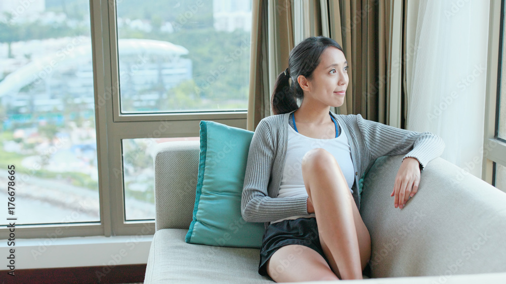 Woman feeling relax and looking out of window Woman feeling relax and looking out of window