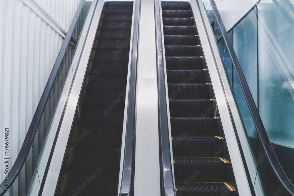 empty escalator in office business building empty escalator in office business building