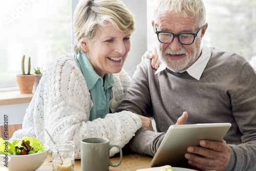 Senior couple using a tablet photo
