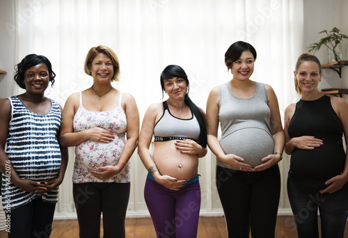 Pregnant women in a class photo