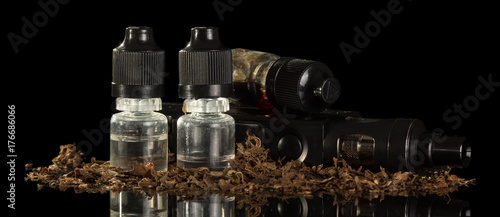 Εκτύπωση καμβά Electronic cigarette and liquid with nicotine isolated on black background
