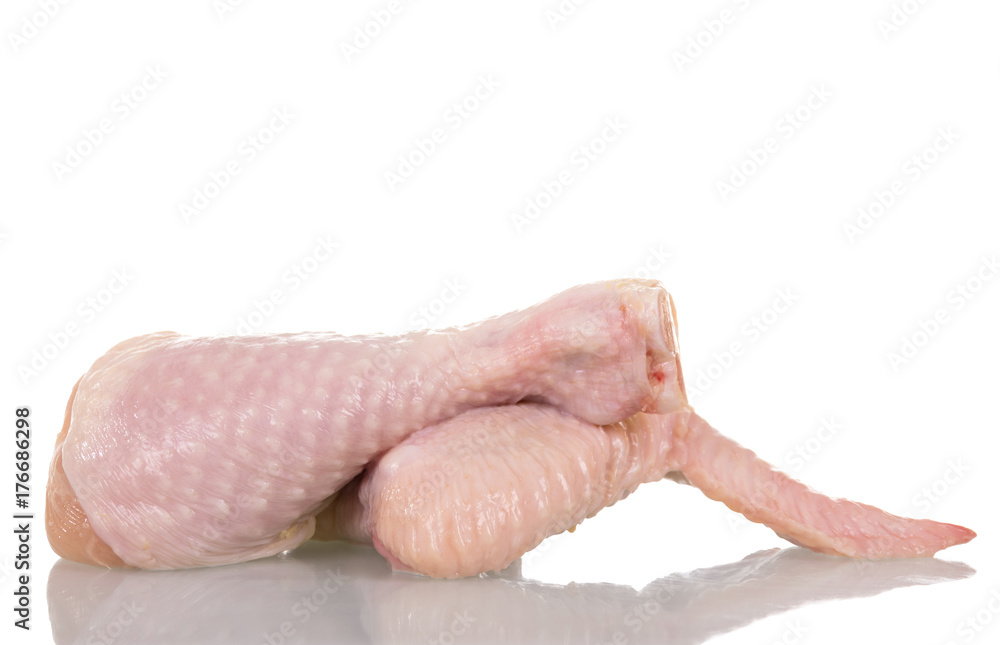 Raw chicken leg and wing isolated on white. Raw chicken leg and wing isolated on white.