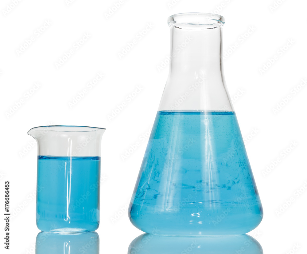 A chemical flask and beaker with blue liquids close-up isolated on white background. A chemical flask and beaker with blue liquids close-up isolated on white background.