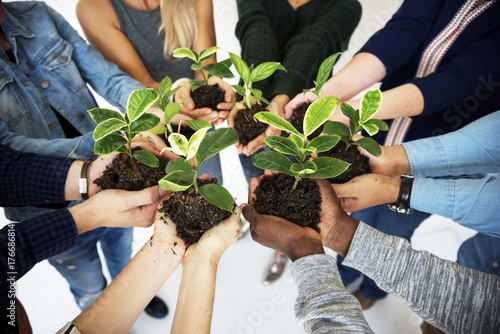 People holding plants in their hands