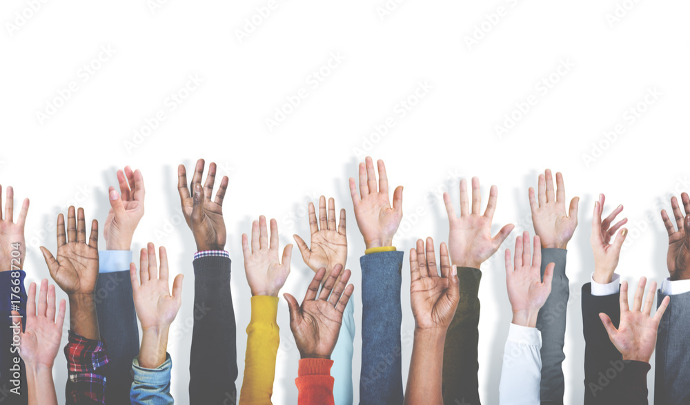 Diverse group of raised hands