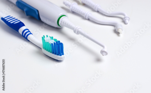 Dental oral irrigator, toothbrush. On a white background