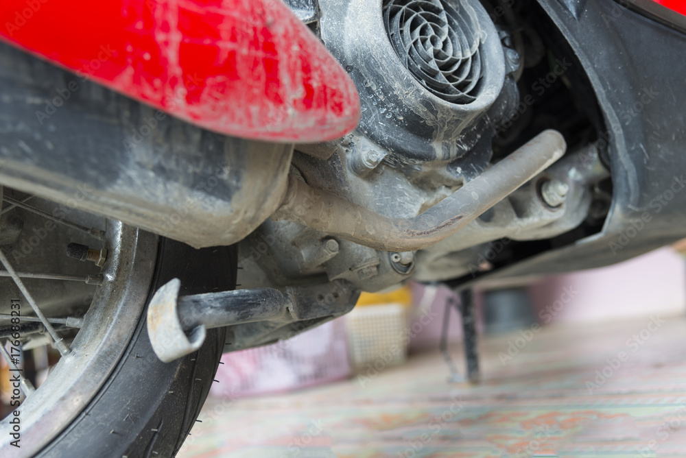 Fototapeta premium Mud stain on motorcycle at back inside on engine and wheel
