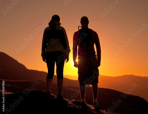 Couple enjoying the beautiful sunset.