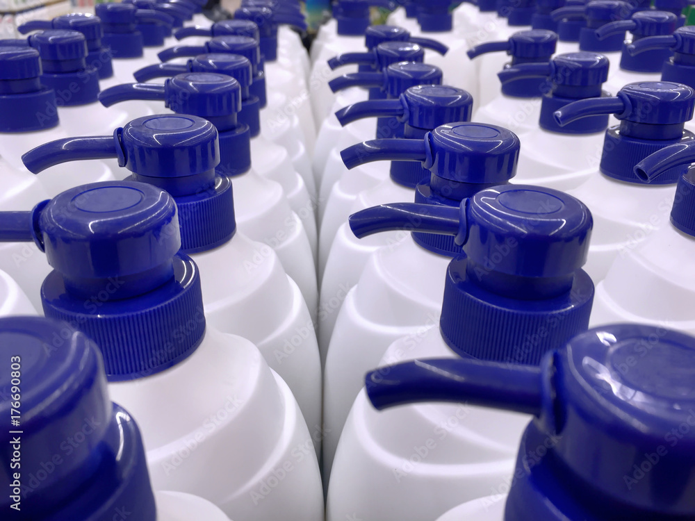 White Shampoo Bottles with Blue Dispensing Caps White Shampoo Bottles with Blue Dispensing Caps