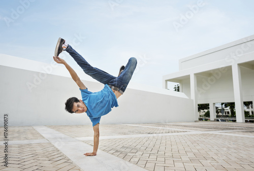 Young man breakdancing photo