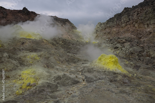 Yellow fumaroles on the volcanic Mount Io, Hokkaido, Japan
