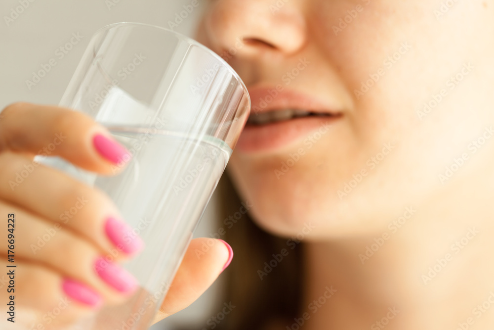 Young woman drinking water