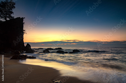 Travel And vacation concept  beautiful tropical beach sunrise sea view. soft wave hitting sandy beach