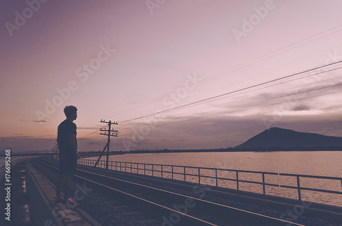 Silhouette The Lonely Man Stand on Railway See to Mountain He Miss Somebody