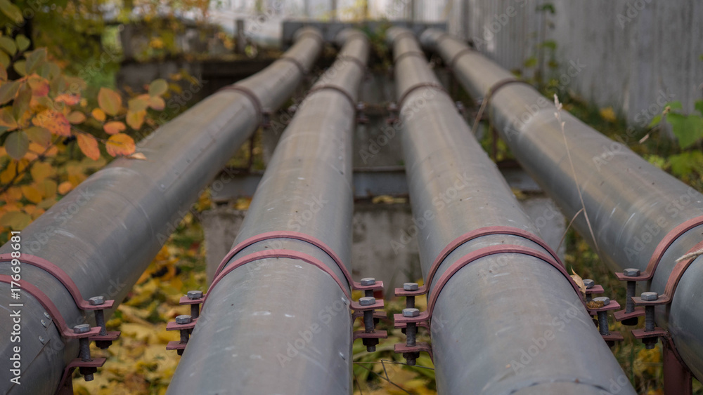 steel pipes 4 pieces go into the distance in perspective. autumn landscape steel pipes 4 pieces go into the distance in perspective. autumn landscape