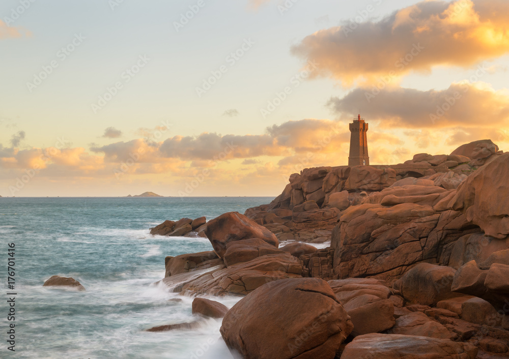 The beautiful lighthouse Phare Mean Ruz on the cote granite rose coast in Ploumanch, Brittany