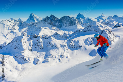 Skiing with amazing view of swiss famous mountains in beautiful winter snow Mt Fort. The matterhorn and the Dent d'Herens. In the foreground the Grand Desert glacier.