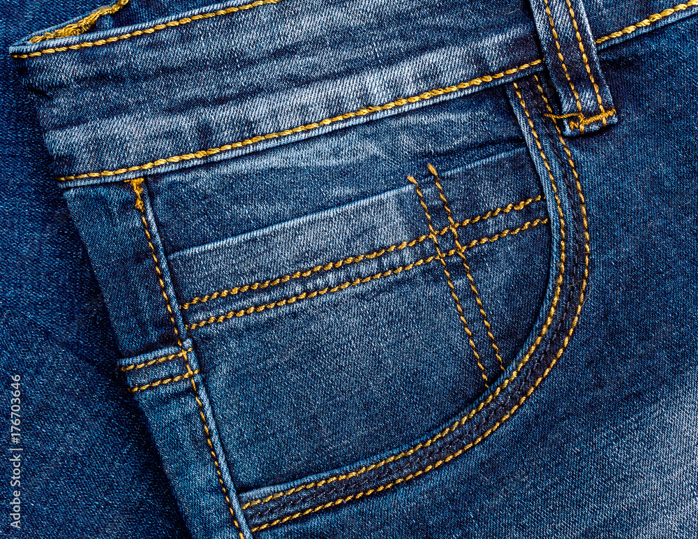 Front pocket of blue jeans pants. Close up. Front pocket of blue jeans pants. Close up.