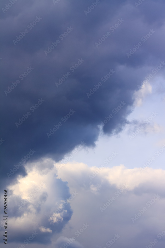 Background of blue dramatic clouds in the dark sky before a thunderstorm.