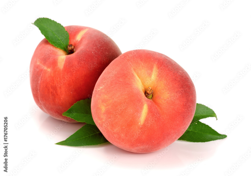 Two peaches with green leaf isolated on white background Two peaches with green leaf isolated on white background