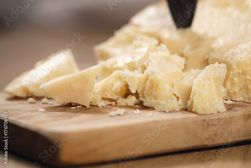traditional grana padano italian cheese on olive board