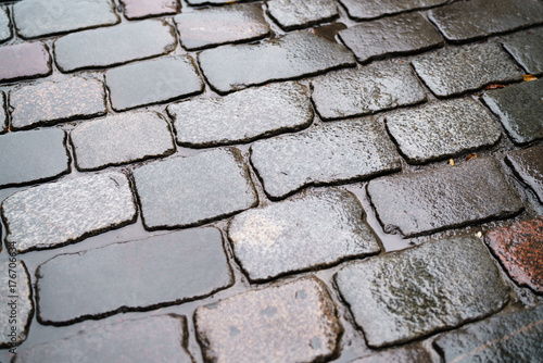 wet old granite pavement closeup