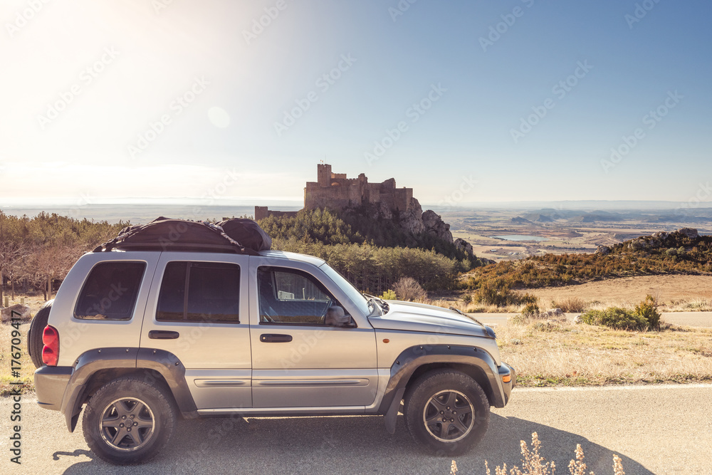 Road trip with castle in background,Spain.