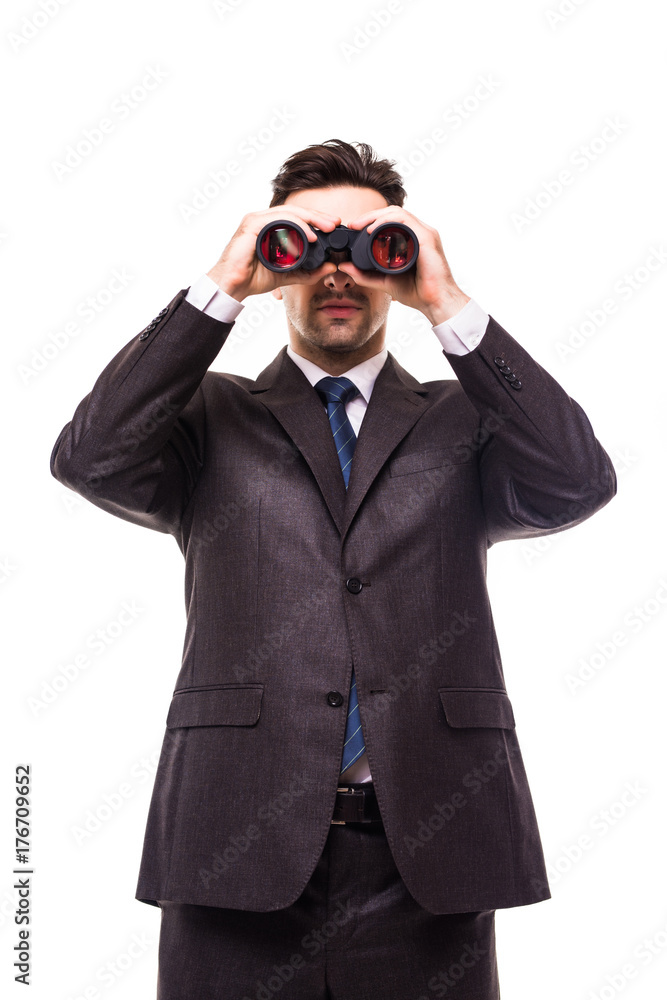 Young businessman wearing formal suit and seeing through binoculars, isolated on white Young businessman wearing formal suit and seeing through binoculars, isolated on white