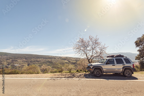 4x4 car on road side in mountains