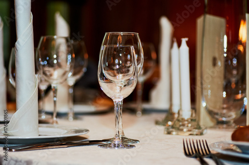 Wedding table centerpieces. glasses, candles. serving wedding table