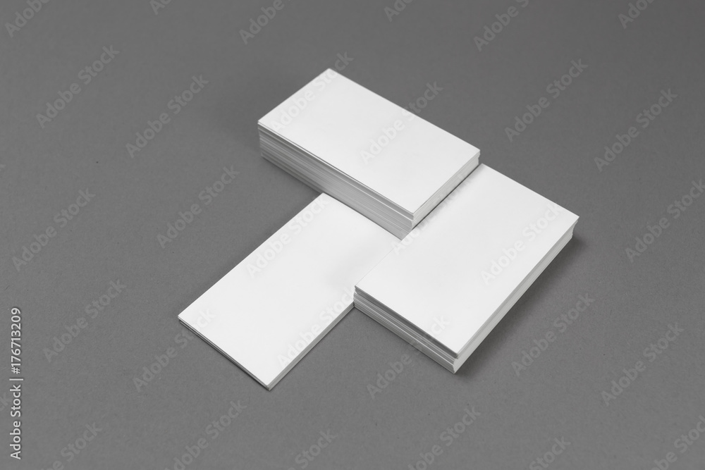 Blank business cards on gray paper background. Mockup for branding identity.