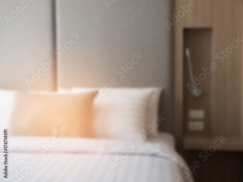 Interior of cozy bedroom in modern design.low lighting and Lens flair in sunlight. color effect and blur background.