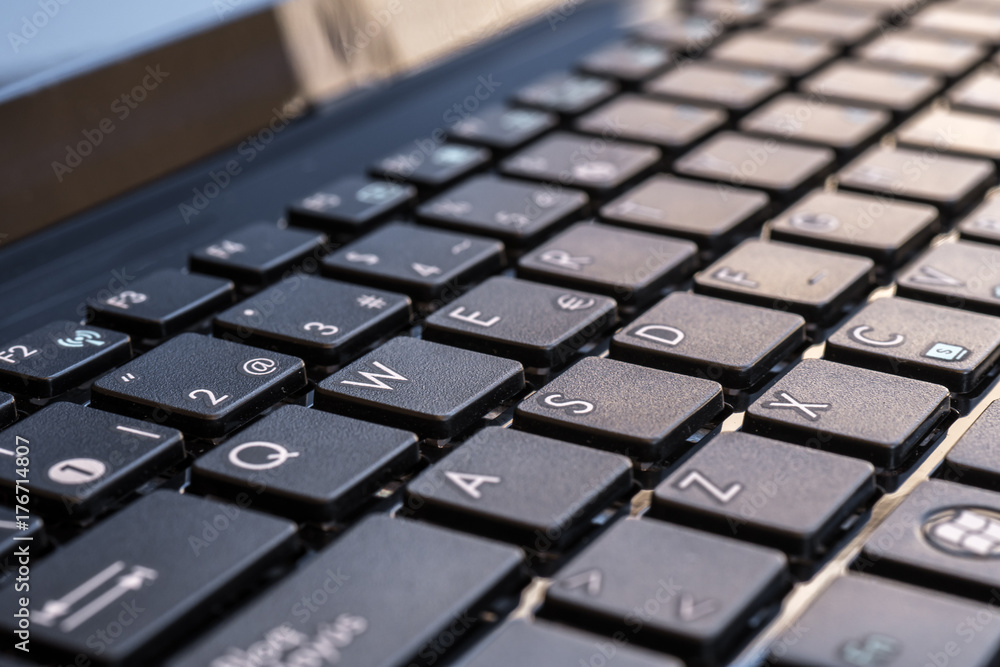 Close-up electronic of laptop keyboard with focus on W button, copy space Close-up electronic of laptop keyboard with focus on W button, copy space