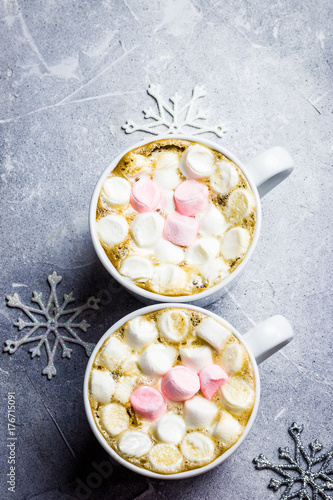 Winter christmas hot chocolate marshmallow in cups. Snowman postcard concept. Top view, space for text.