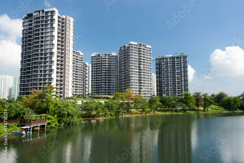 Lanscape view of condomium with trees near river