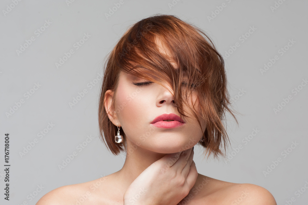 Hairstyle advertising. Beauty girl portrait. Female introvert closeup, modern fashion look, young woman with clean skin on grey background. Dreams, calmness, healthy mind concept Hairstyle advertising. Beauty girl portrait. Female introvert closeup, modern fashion look, young woman with clean skin on grey background. Dreams, calmness, healthy mind concept