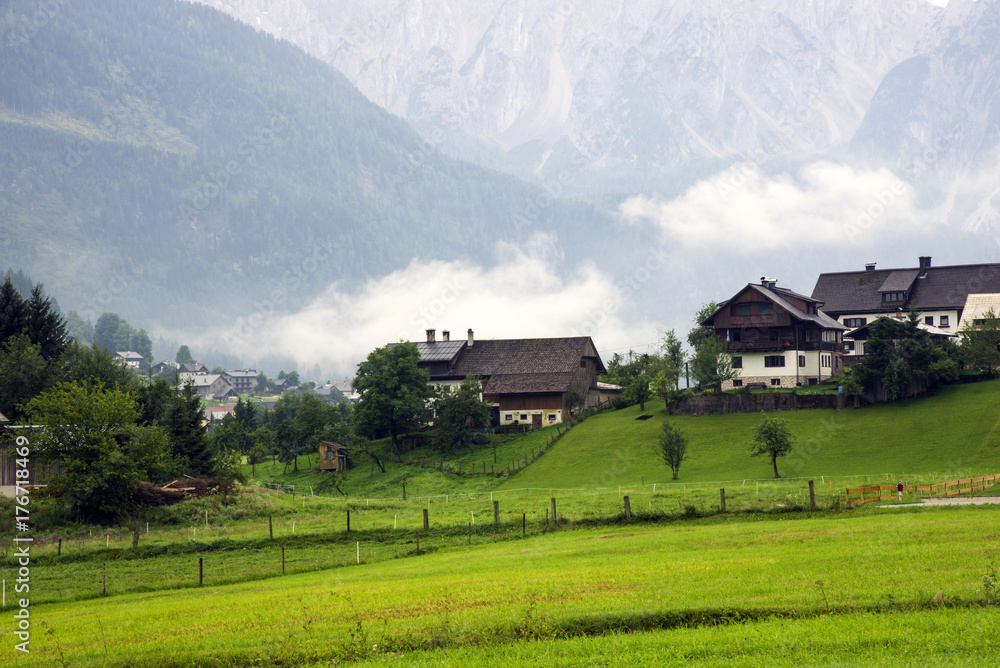 A small Austrian village on a foggy morning.