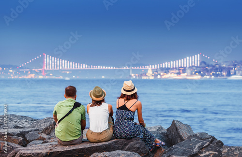 Canvas Print Young friends student or travelers in hat enjoying great view of the Bosphorus B