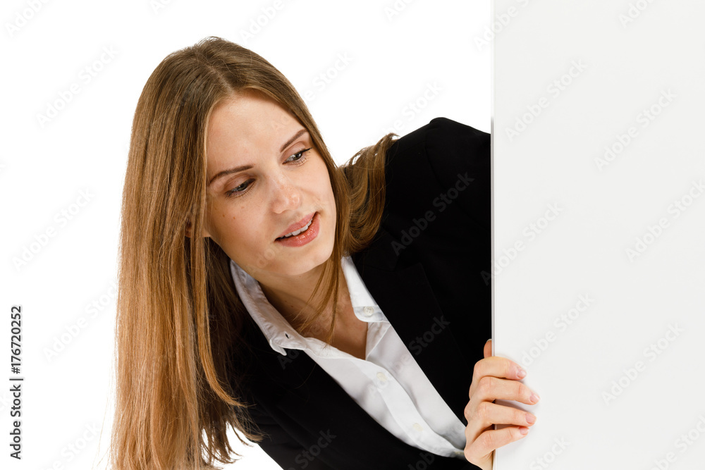 Young attractive girl peeking behind blank board on white background Young attractive girl peeking behind blank board on white background