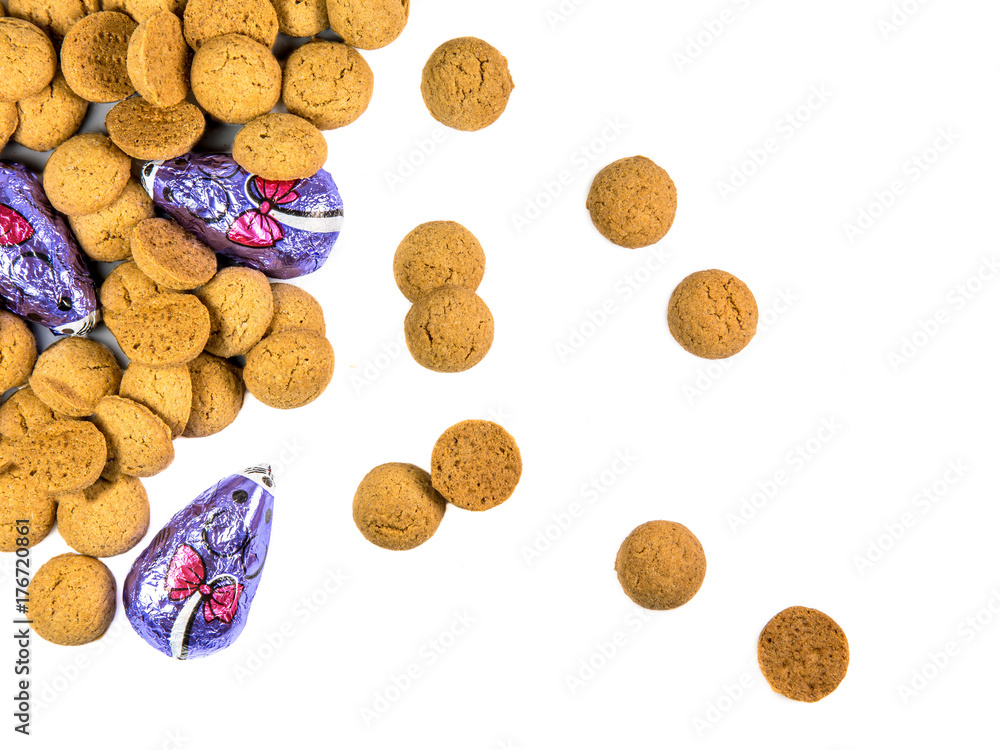 Scattered bunch of Pepernoten cookies and chocolate mice Scattered bunch of Pepernoten cookies and chocolate mice
