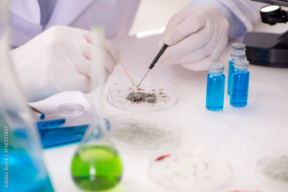 Male doctor working in the lab on virus vaccine Male doctor working in the lab on virus vaccine