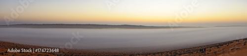 Panoramic of Sunrise in Wahiba Sands desert in Oman with mist