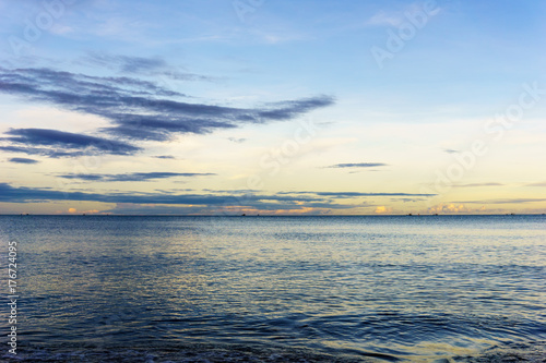 beautiful panorama landscape of sea at the beach at dusk in evening when sunset with golden light with mountain  blue sky and cloud  background. sky and sea twilight.